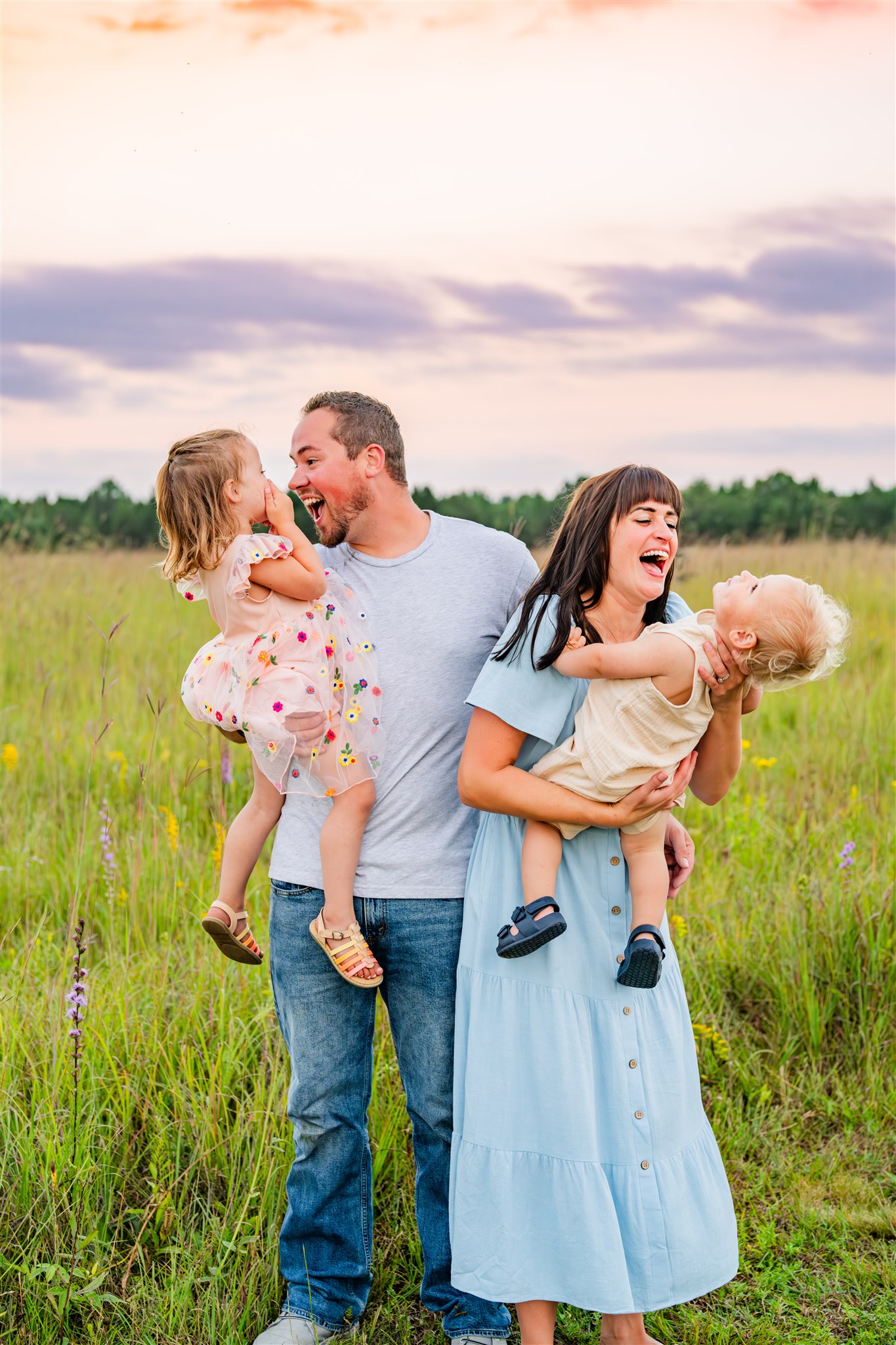 mom and dad playing with kids during family lifestyle photography session